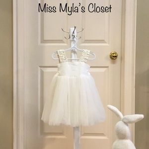 Pre loved Fattiepie Girls cream coloured party dress. Size 2.